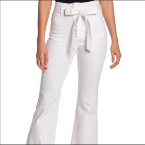 Jealous Tomato tie waist flare jeans in white.